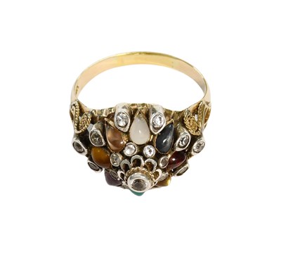 Lot 443 - A Multi-Gem Set Ring, the central raised...