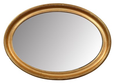 Lot 1354 - An Oval Gilt-Framed Wall Mirror, in reeded...