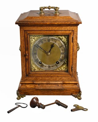 Lot 360 - An Oak Quarter Striking Table Clock, retailed...