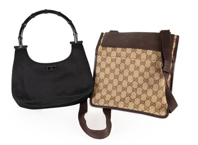 Lot 1016 - A Gucci GG Monogram Woven Logo Messenger Bag,...