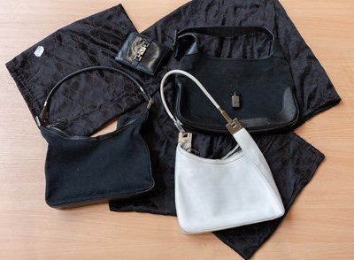 Lot 1207 - A Gucci White Leather Handbag, with chrome...