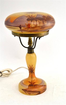 Lot 212 - Glass table lamp and shade painted with Eastern scenes