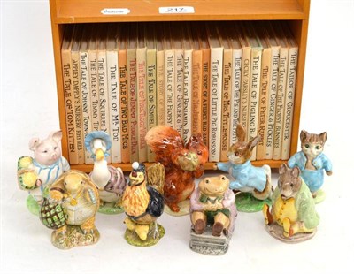 Lot 217 - Nine assorted Beatrix Potter figures (one chipped ear), brown back stamps and a miniature...