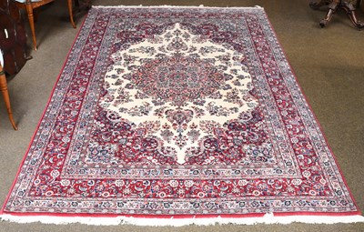 Lot 1095 - Tabriz Carpet, the ivory field centred by a...