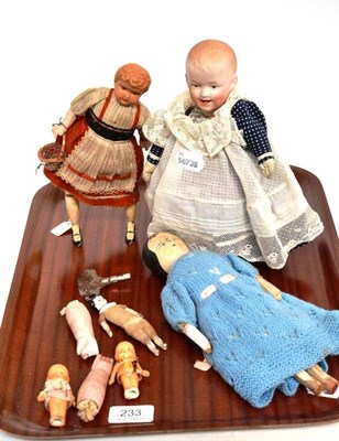 Lot 233 - German bisque head on a mechanical base, painted wooden doll, pair of bisque arms, china head...