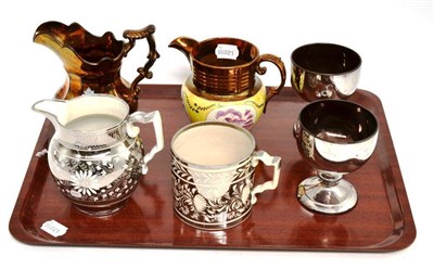 Lot 240 - Two copper lustre jugs, two goblets and a silver lustre jug and mug