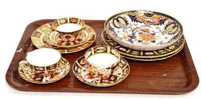 Lot 245 - A Royal Crown Derby Imari trio, two cups and saucers, two plates and a dish