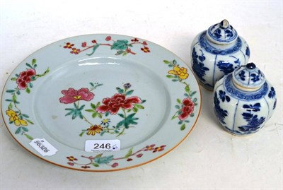 Lot 246 - An 18th century Chinese famille rose plate; a pair of Chinese blue and white small vases and covers