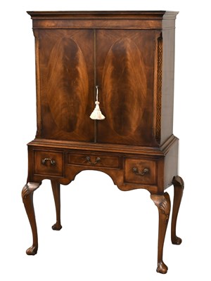 Lot 1355 - A Reproduction Walnut Cocktail Cabinet, inlaid...