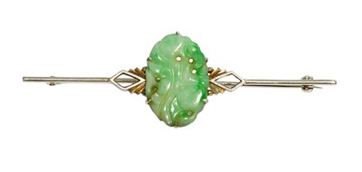Lot 312 - A Jade Bar Brooch, the oval carved and pierced...