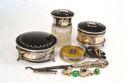 Lot 275 - Three tortoiseshell topped bottles, button hook etc