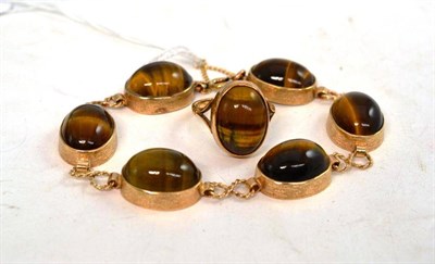 Lot 279 - A yellow metal tigers eye bracelet and a tigers eye ring stamped '9CT' to match