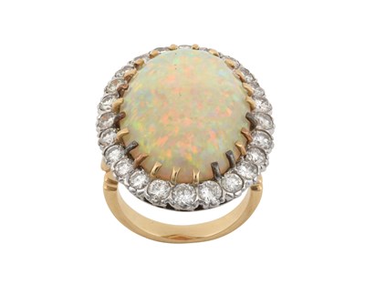 Lot 2267 - An Opal and Diamond Cluster Ring the oval...