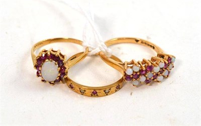 Lot 294 - A 9ct gold opal and ruby cluster ring, another and a 9ct gold ruby and diamond ring