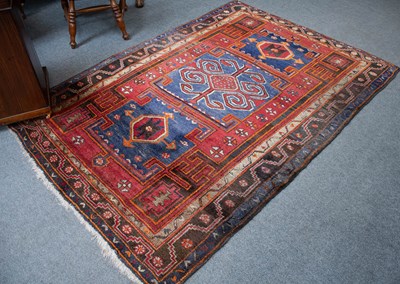 Lot 1314 - North West Persian Rug, the field with three...