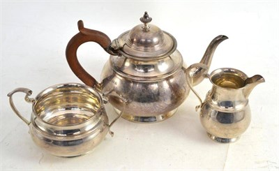 Lot 334 - A silver three piece tea service