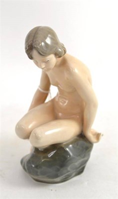 Lot 336 - A Royal Copenhagen nude on a rock