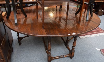 Lot 1431 - A 20th Century Oak Gateleg Dining Table, in...