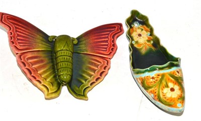 Lot 352 - Linthorpe pottery butterfly wall pocket, unmarked, 17cm and a Linthorpe pottery slipper wall...