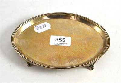 Lot 355 - A George III silver teapot stand of elliptical form, London 1790