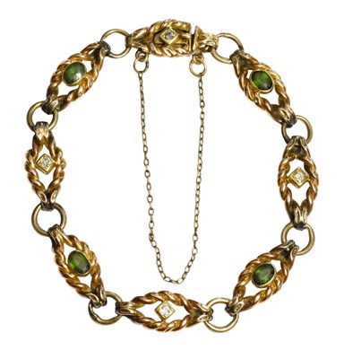 Lot 345 - A Green Tourmaline and Diamond Bracelet, eight...