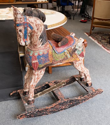 Lot 1483 - A Painted Eastern Style Rocking Horse, 114cm high