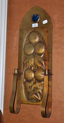 Lot 380 - An Arts and Crafts copper wall sconce mounted with a blue cabochon