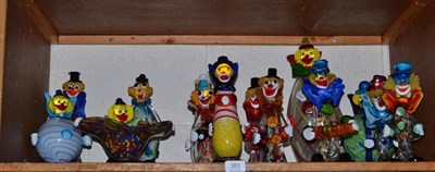 Lot 383 - Fourteen glass clowns