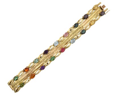 Lot 2272 - An 18 Carat Gold Multi-Gem Set Bracelet two...