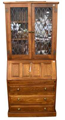 Lot 1539 - An Oak Cryer Craft Bureau Bookcase, 80cm by...
