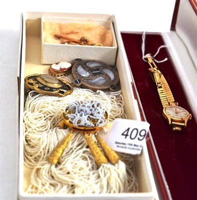 Lot 409 - A mourning brooch, an agate set brooch, a lady's Omega wristwatch, a cameo pendant, a pearl...