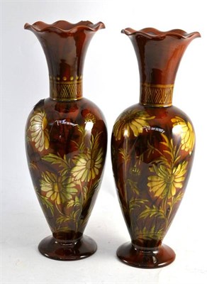 Lot 435 - A matched pair of Linthorpe pottery vases, decorated with flowers, impressed 'Linthorpe 2219',...