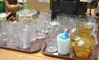 Lot 442 - Glass comprising: seven Victorian pressed glass mugs, a bread dish, engraved mug, amber and...