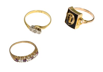 Lot 364 - A Diamond Three Stone Twist Ring, stamped...
