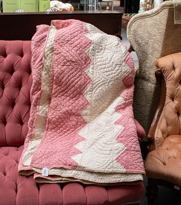 Lot 1302 - A Pink and White Zig Zag Quilt, with a white...