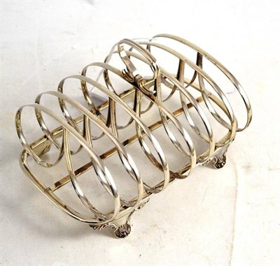 Lot 489 - A William IV silver toast rack, London 1830