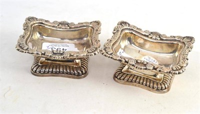 Lot 493 - A pair of George III silver salts with foliate cast borders, London possibly 1812 (marks rubbed)