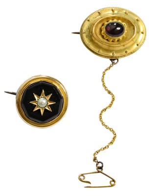 Lot 452 - A Garnet Brooch, the oval cabochon garnet set...