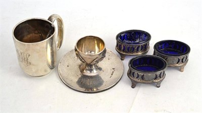 Lot 500 - Three silver oval salts, silver egg cup, a small mug and two spoons