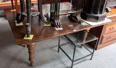 Lot 1451 - A 1920s Oak Fold-out Dining Table, on turned...