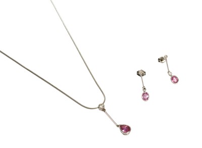 Lot 487 - A Pink Sapphire and Diamond Drop Pendant on...
