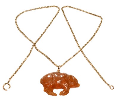 Lot 432 - An Amber Pendant on Chain, the carved amber in...