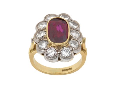 Lot 2334 - An 18 Carat Gold Ruby and Diamond Cluster Ring...