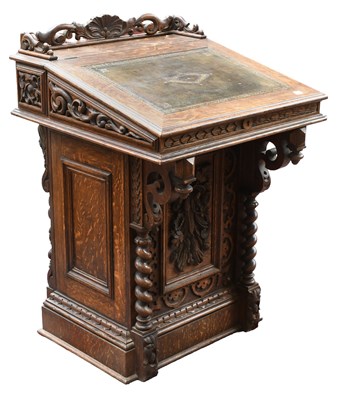 Lot 1418 - A Victorian Oak Davenport, with carved...
