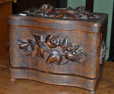 Lot 544 - A carved walnut liqueur box and glasses