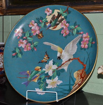 Lot 549 - A Montereau pottery charger, circa 1870, painted in faux cloisonné style with a parrot,...