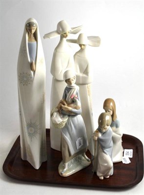 Lot 554 - Five Lladro figures of children and nuns