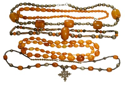Lot 513 - Four Amber/Amber Type Necklaces, of varying...