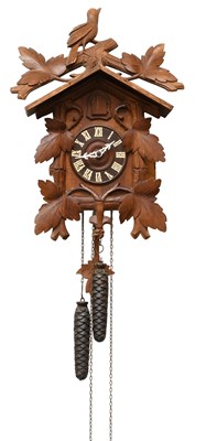 Lot 1482 - A 20th Century Cuckoo Clock, twin weight...