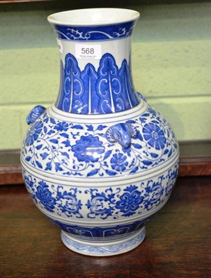 Lot 568 - A Chinese blue and white porcelain ovoid vase with three ram mask shoulder panels